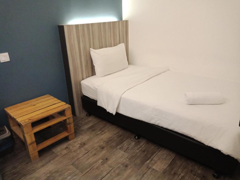 Postel nebo postele na pokoji v ubytování The Verve Hotel PJ Damansara