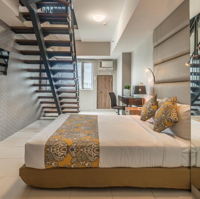 Postel nebo postele na pokoji v ubytování Hotel Kimberly Manila