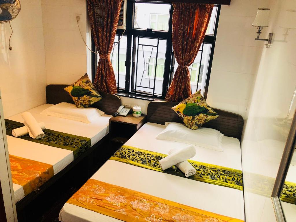 Katil atau katil-katil dalam bilik di Traveller's Hostel