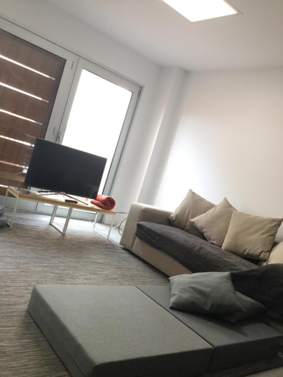 A television and/or entertainment centre at AMAZING DUPLEX on the beach