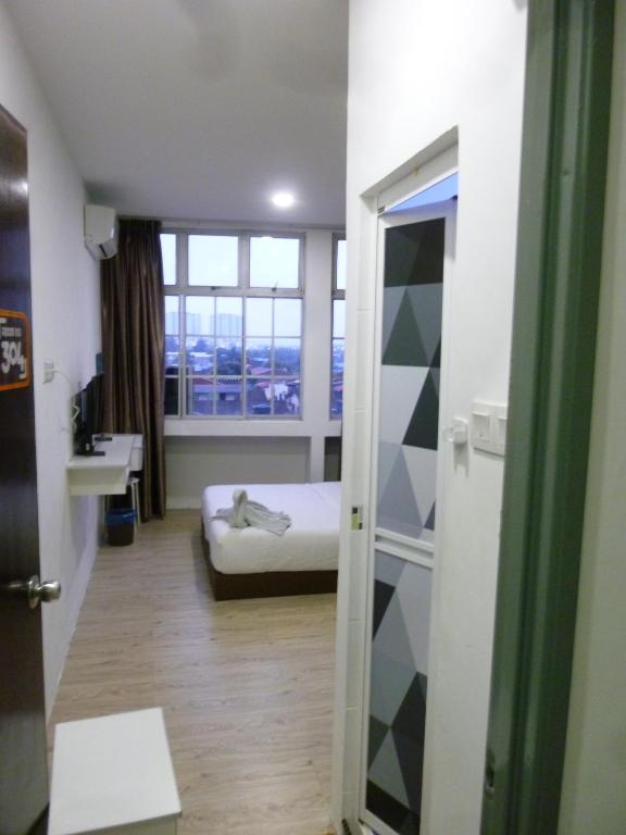 Postel nebo postele na pokoji v ubytování The b'Hotel