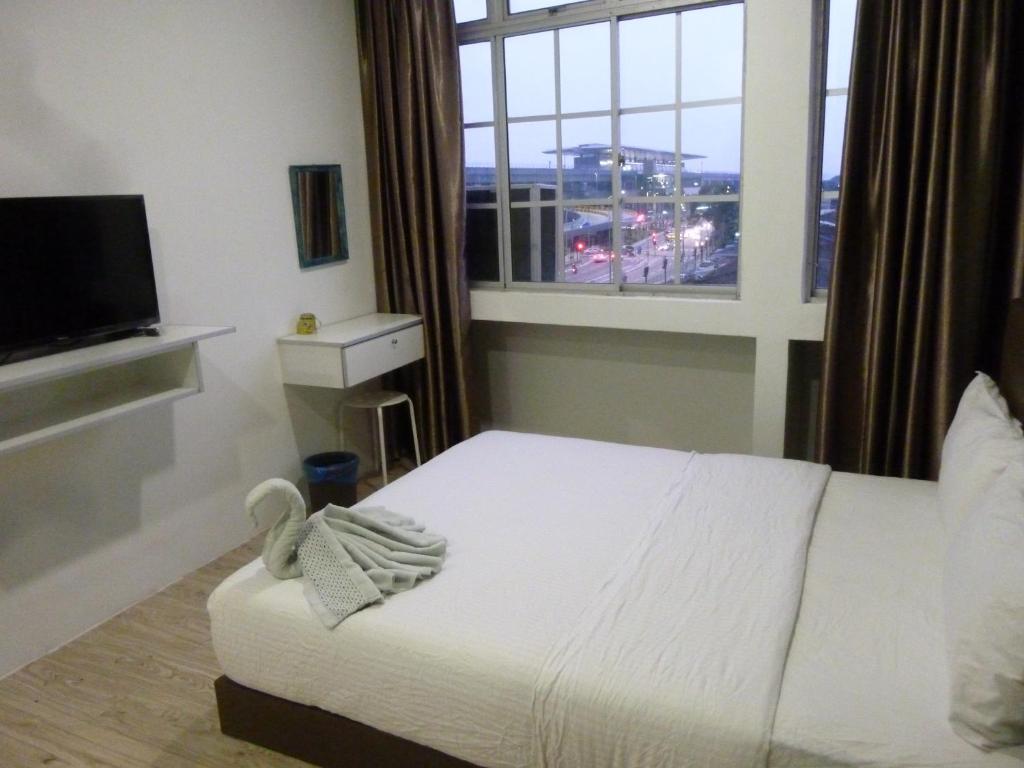 Postel nebo postele na pokoji v ubytování The b'Hotel