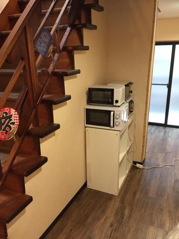 Kuchyň nebo kuchyňský kout v ubytování Ryokan Ichinao