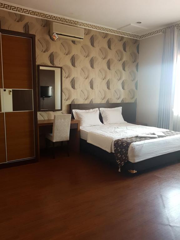 Кровать или кровати в номере Ndalem Bintaran