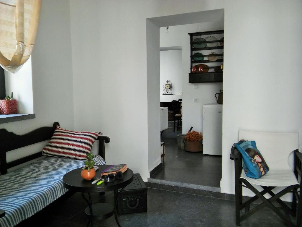 a living room with a couch and a table at House of memories in Neápolis