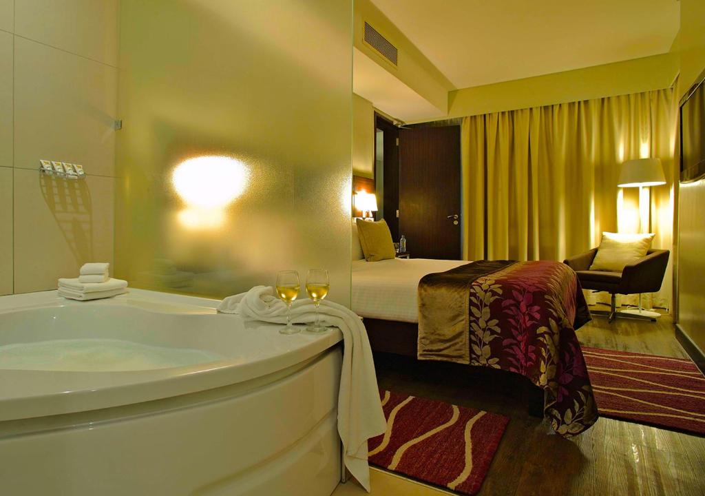 Postel nebo postele na pokoji v ubytování Eka Hotel Nairobi