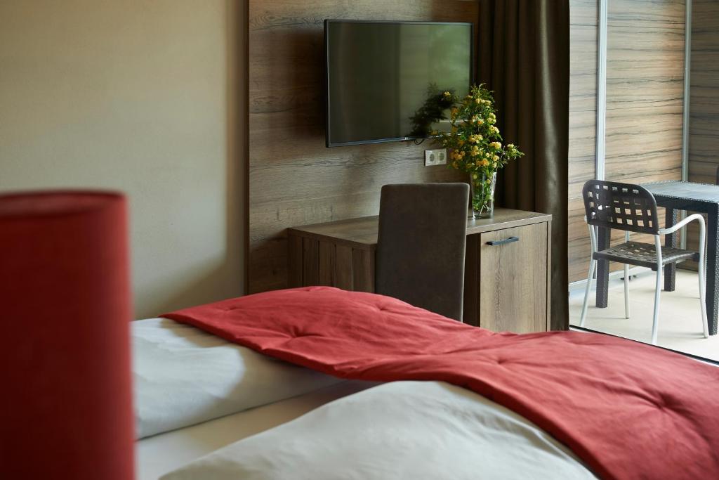 Postel nebo postele na pokoji v ubytování Hotel Gantkofel