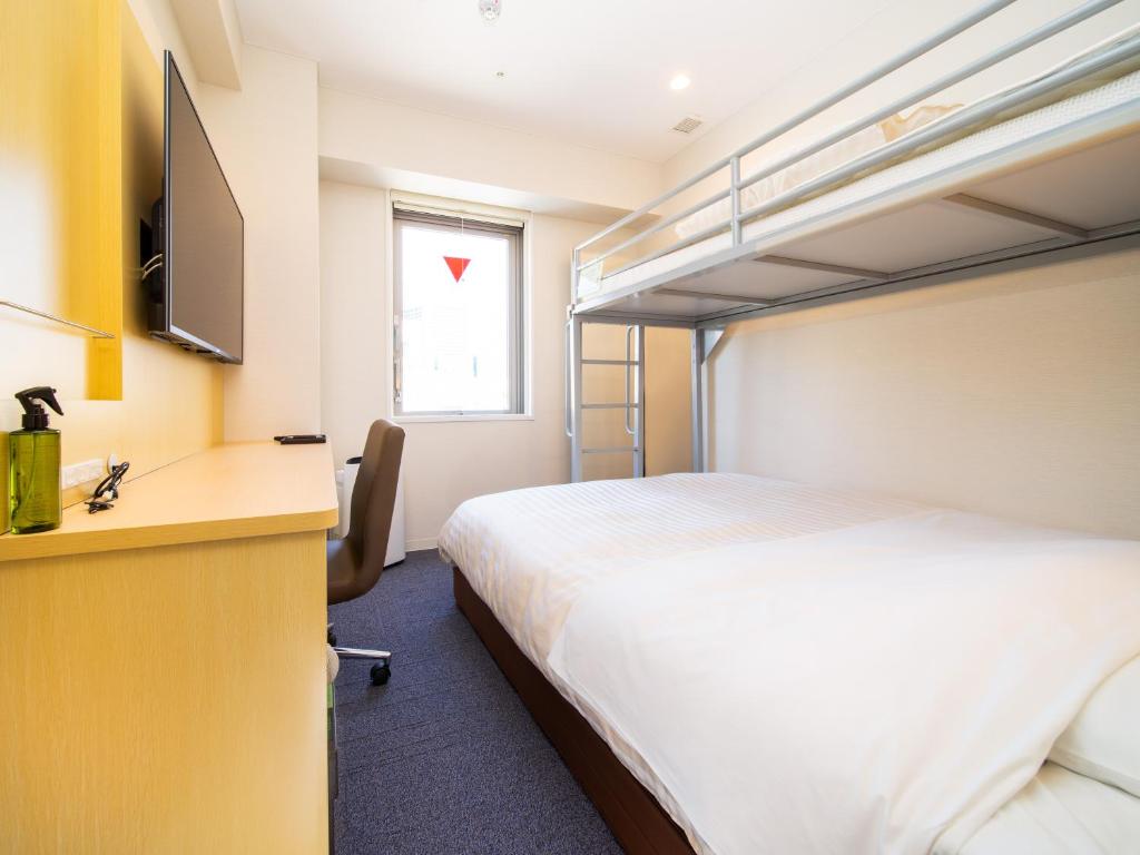 Postel nebo postele na pokoji v ubytování Super Hotel Tokyo Shiba