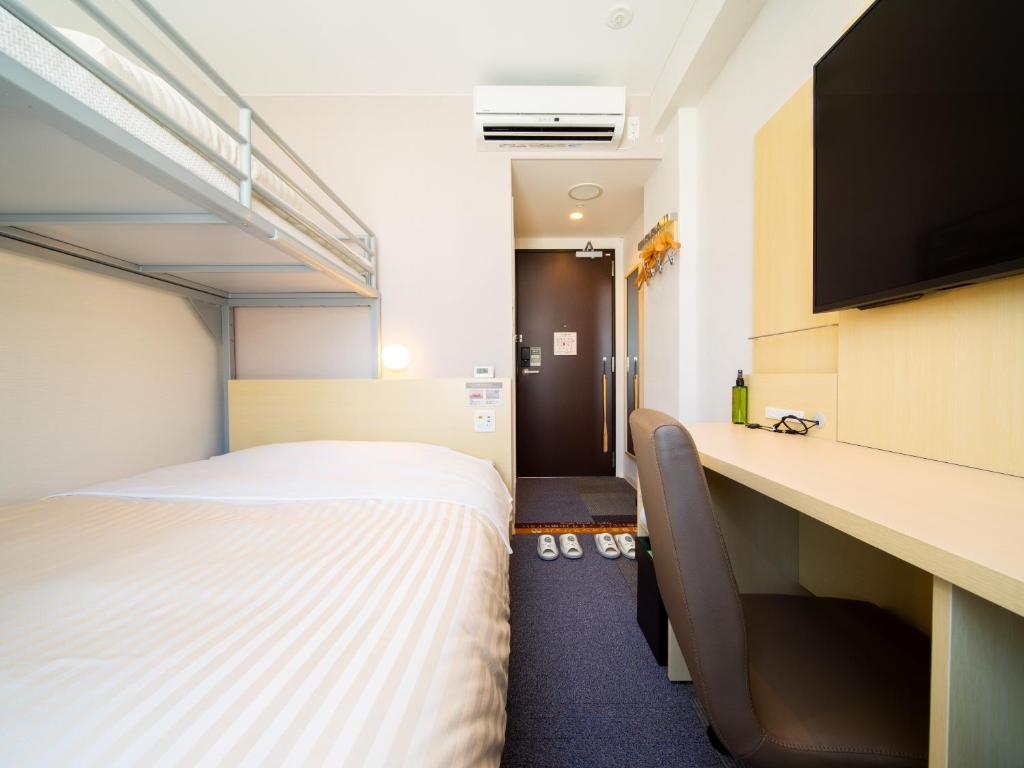 Postel nebo postele na pokoji v ubytování Super Hotel Tokyo Shiba