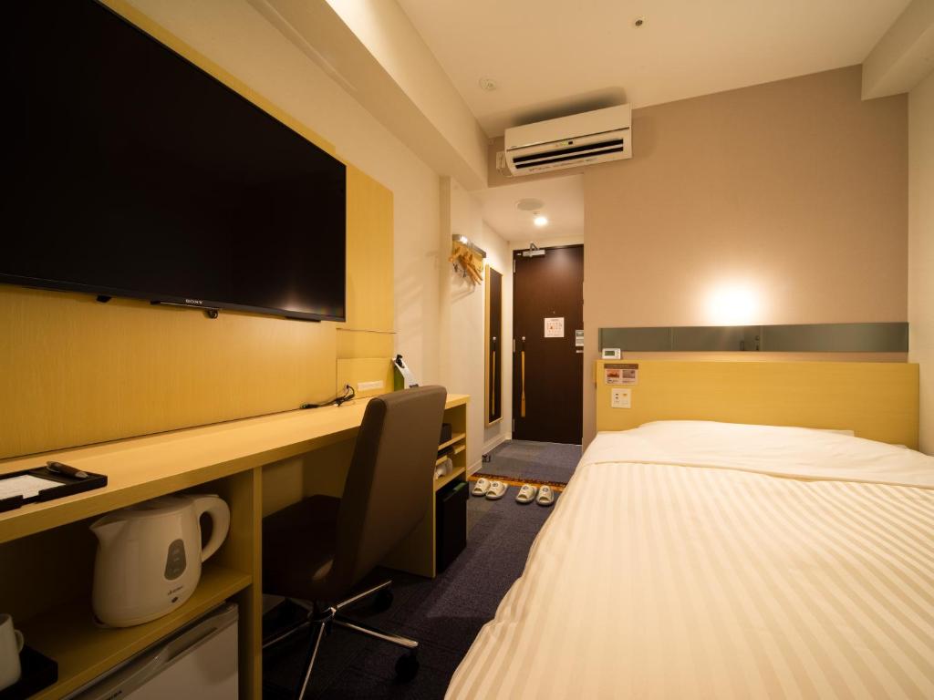 Postel nebo postele na pokoji v ubytování Super Hotel Tokyo Shiba