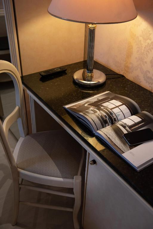 Postel nebo postele na pokoji v ubytování Hotel President