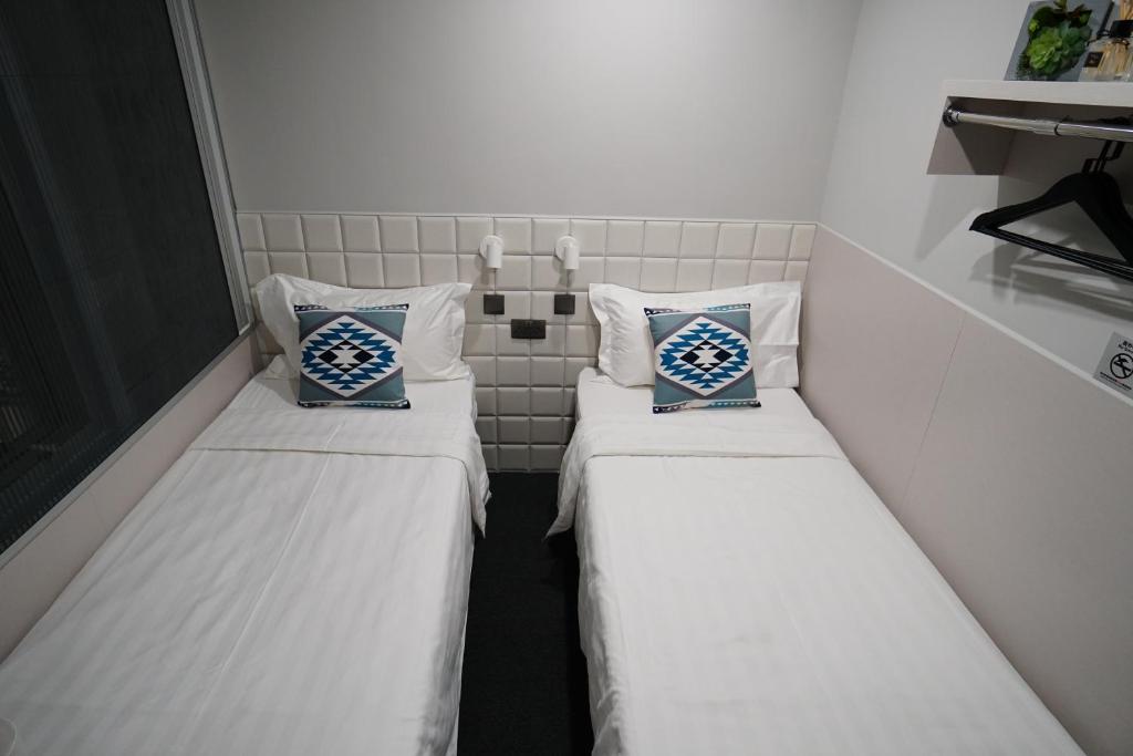A bed or beds in a room at MK STAY - formerly HOTEL MK