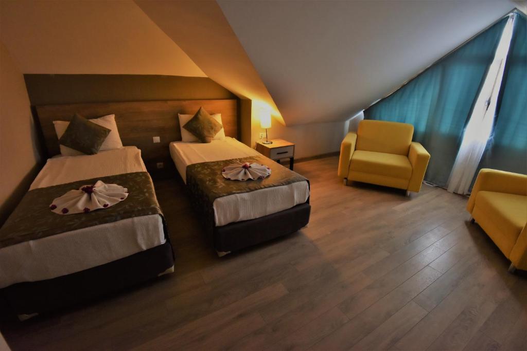 Postel nebo postele na pokoji v ubytování Lucida Beach Hotel - Ultra All Inclusive