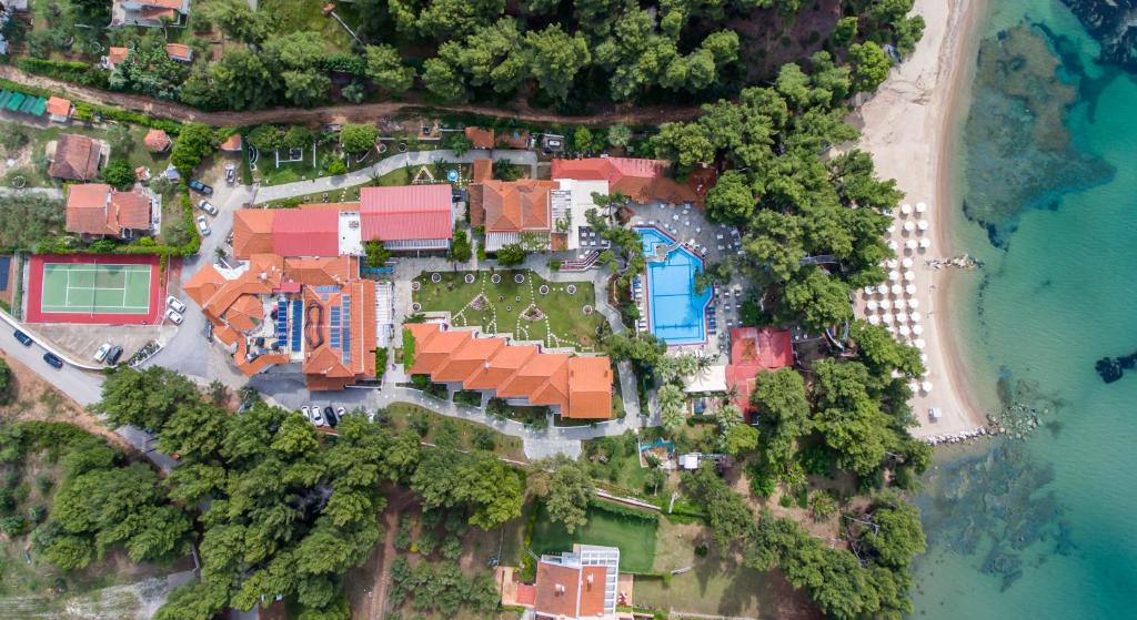 an aerial view of a house on a island next to a beach at Porfi Beach Hotel in Nikiti