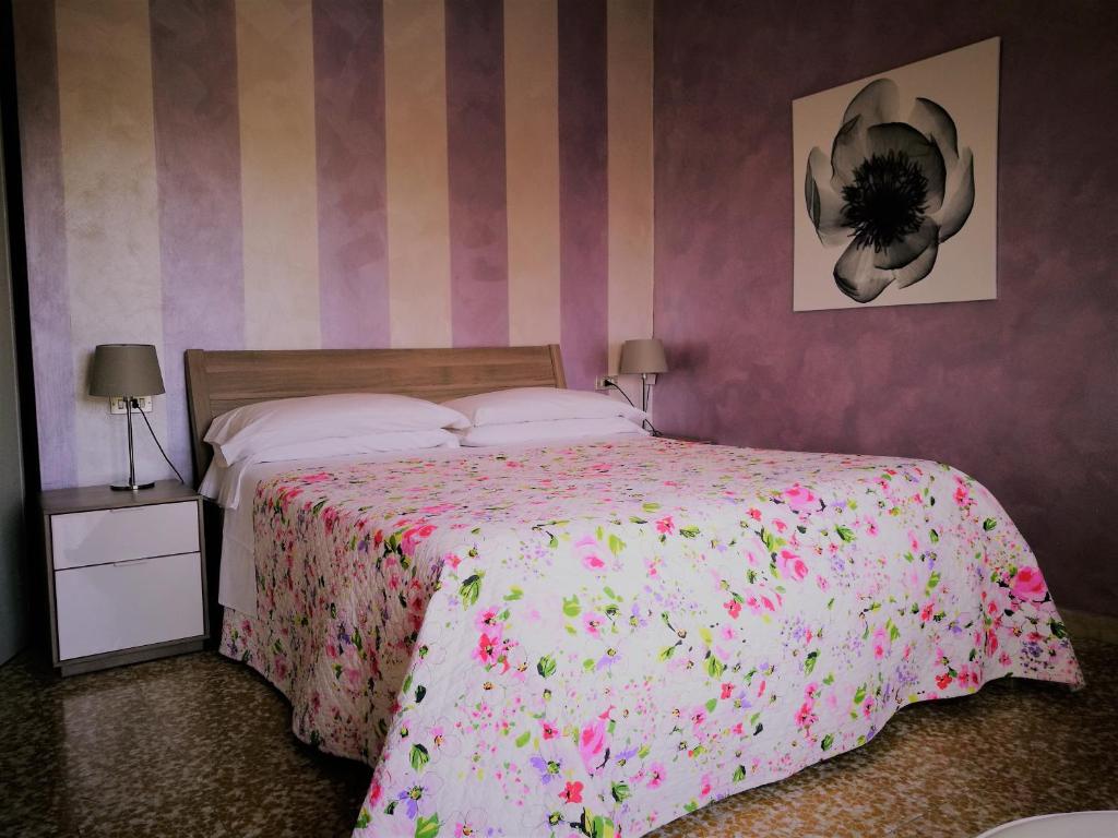 Postel nebo postele na pokoji v ubytování Hotel Mirabello