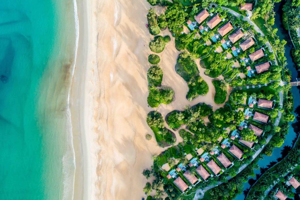 an aerial view of a resort on the beach at Banyan Tree Lang Co in Lang Co