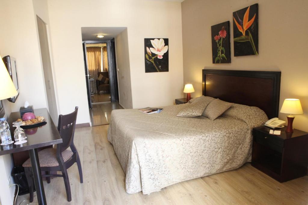 Postel nebo postele na pokoji v ubytování Mozart Hotel