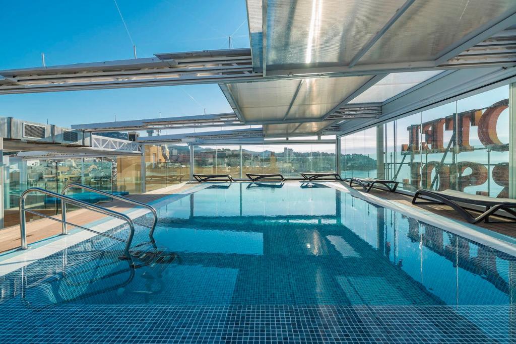 a large swimming pool on top of a building at Hotel Marsol in Lloret de Mar