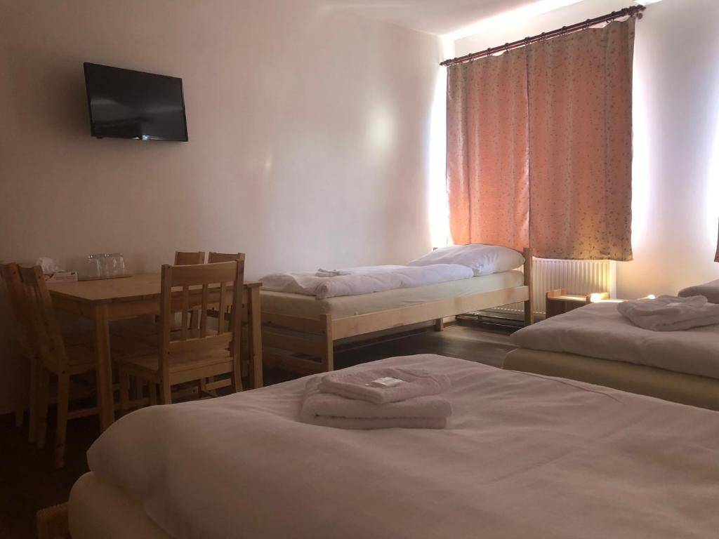 Postel nebo postele na pokoji v ubytování Penzion Hvězda - Restaurace dočasně uzavřena