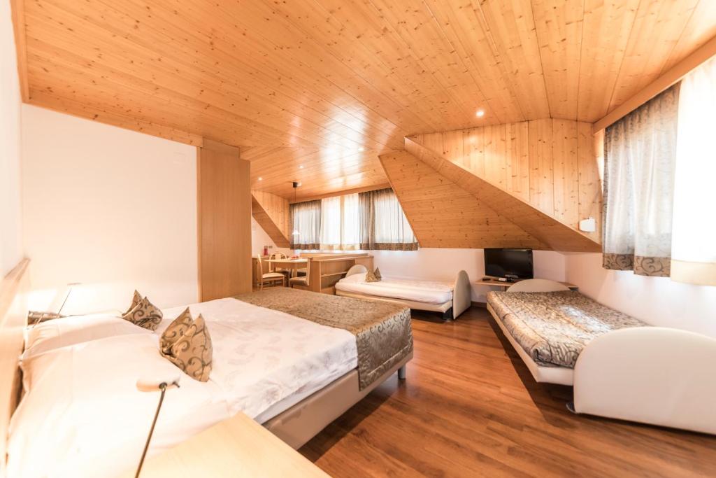 Postel nebo postele na pokoji v ubytování Active Hotel Ancora