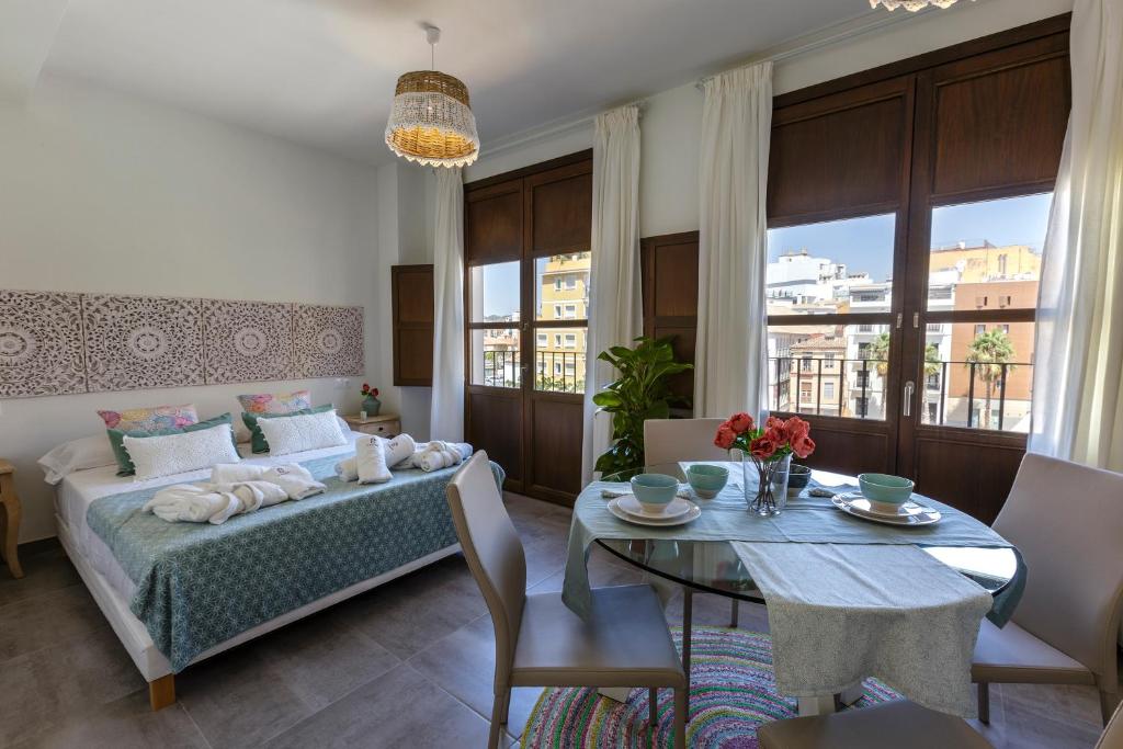 Posteľ alebo postele v izbe v ubytovaní Apartamentos El Marqués