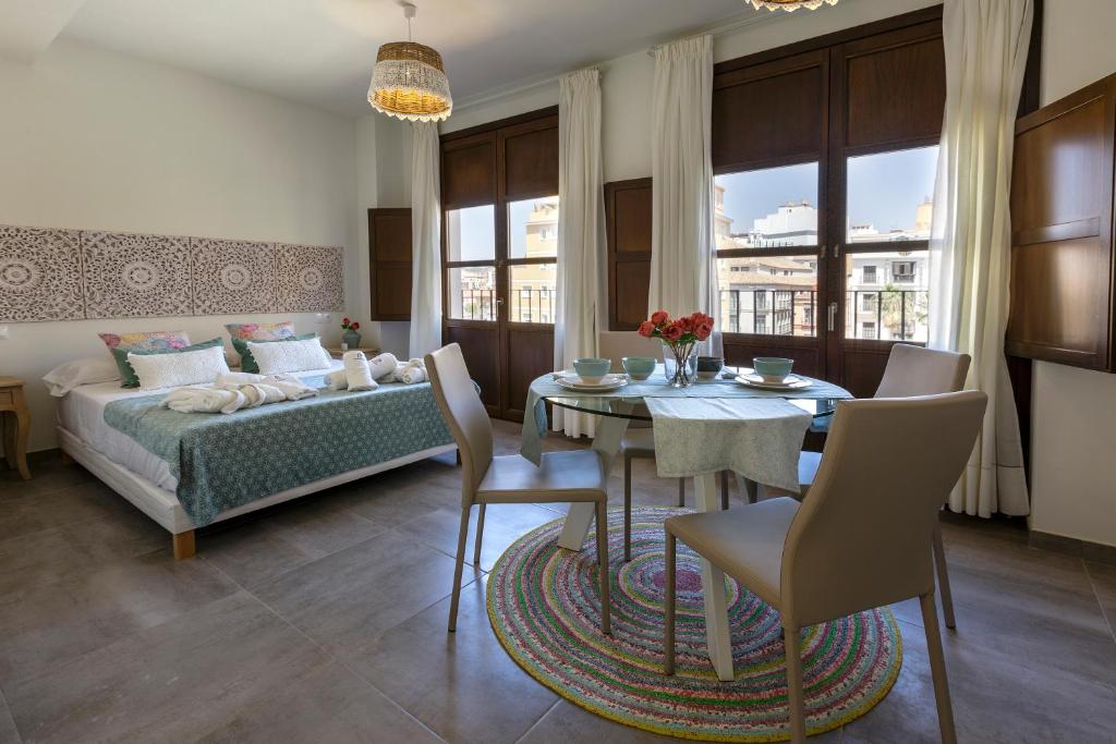 Posteľ alebo postele v izbe v ubytovaní Apartamentos El Marqués