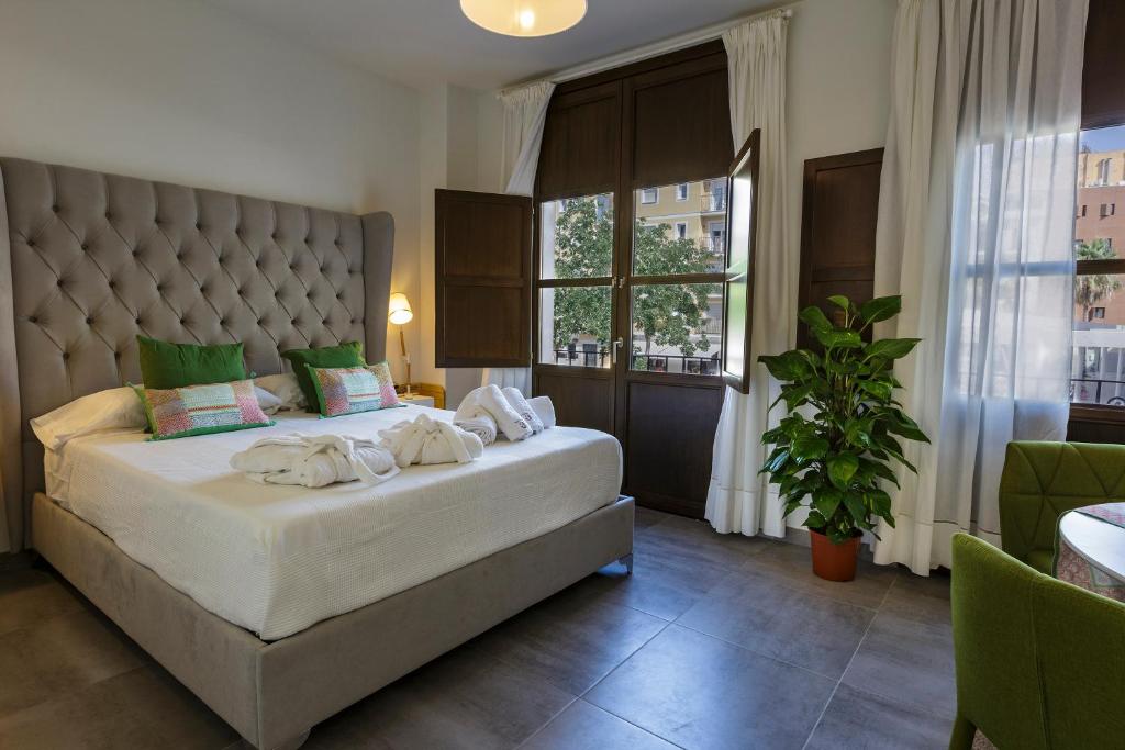 Posteľ alebo postele v izbe v ubytovaní Apartamentos El Marqués