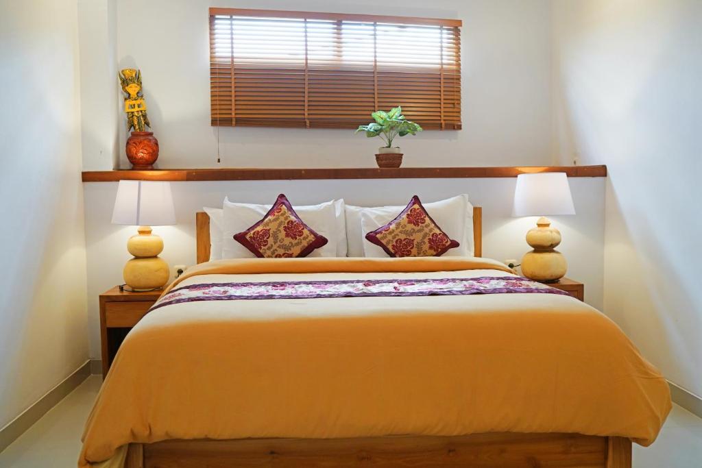 Postel nebo postele na pokoji v ubytování Lebak Bali Residence