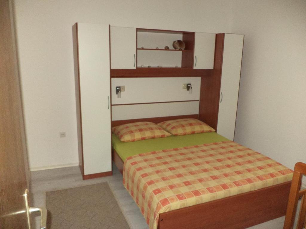 Postel nebo postele na pokoji v ubytování Apartments Mira