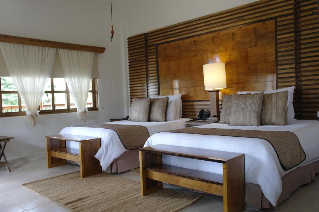 Postel nebo postele na pokoji v ubytování Hotel Casa San Carlos Lodge Pereira
