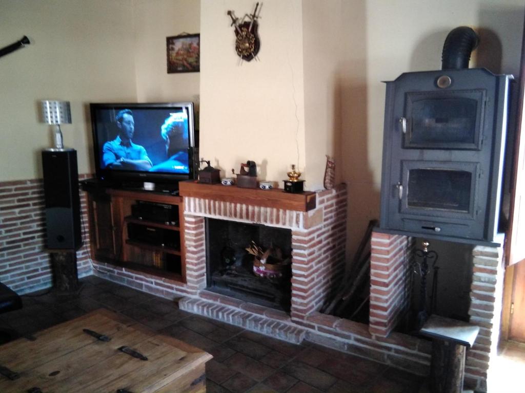 TV a/nebo společenská místnost v ubytování Estudio Rustico