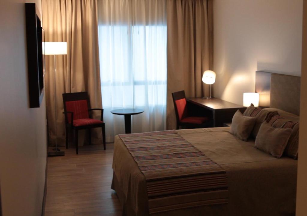 Un pat sau paturi într-o cameră la Hotel UOM Buenos Aires