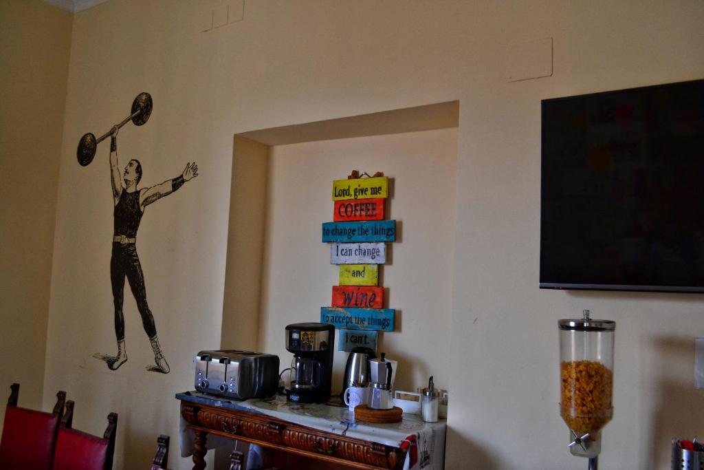 TV a/nebo společenská místnost v ubytování Home Genoa Hostel