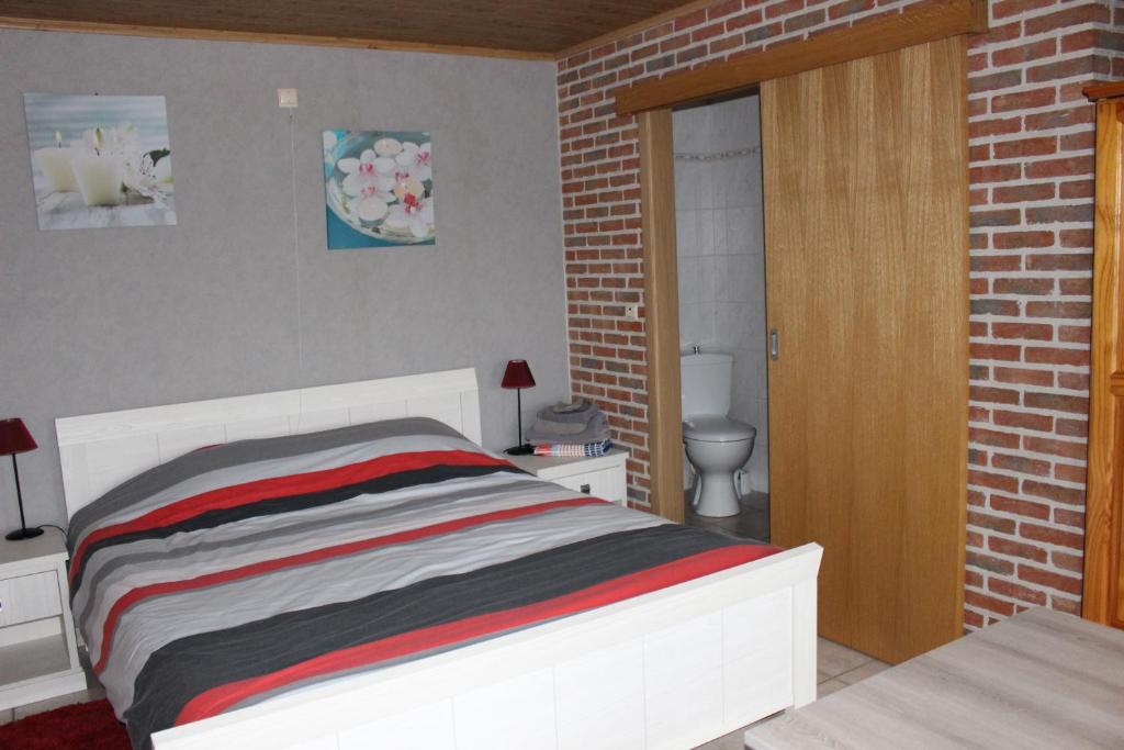 Postel nebo postele na pokoji v ubytování Breeden Steeger Hoeve