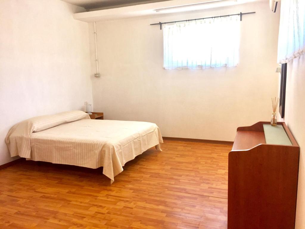 Łóżko lub łóżka w pokoju w obiekcie la casa di Frinky