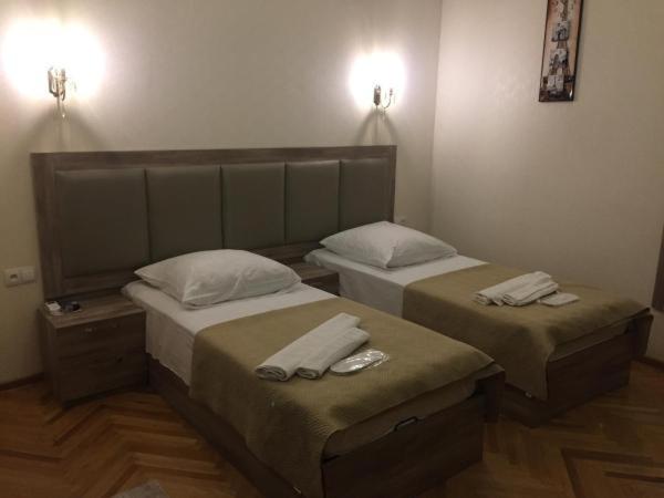 Postel nebo postele na pokoji v ubytování Guest House Rafael