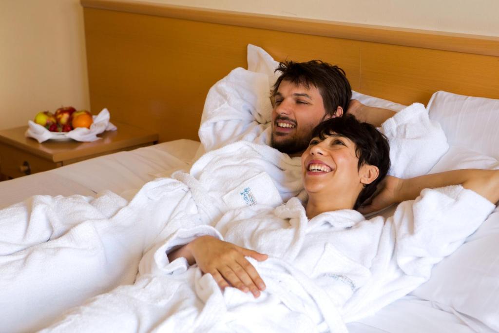 Postel nebo postele na pokoji v ubytování Hotel Montemezzi
