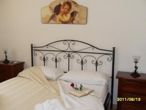 A bed or beds in a room at Perla del Salento