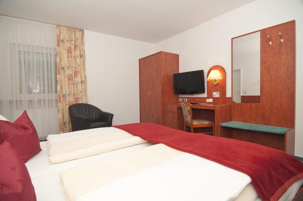 Postel nebo postele na pokoji v ubytování Hotel Hansa