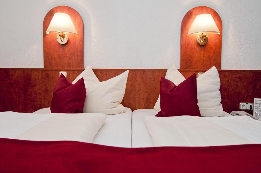 Postel nebo postele na pokoji v ubytování Hotel Hansa