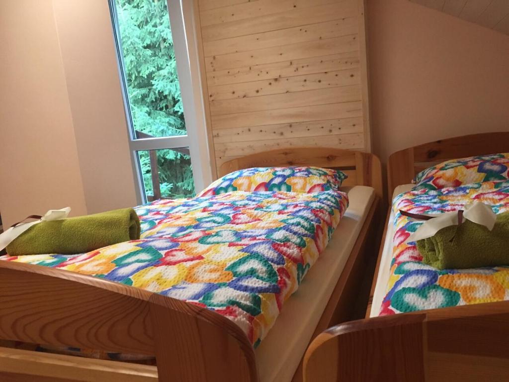 Postel nebo postele na pokoji v ubytování Penzion Kunvald Končiny