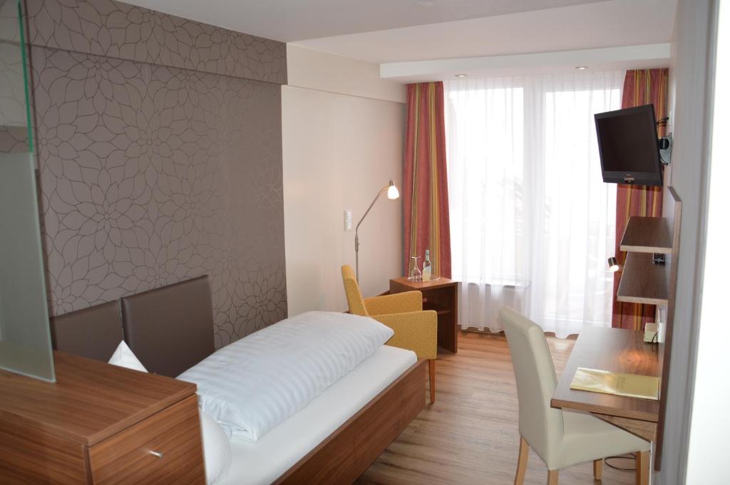 Postel nebo postele na pokoji v ubytování Hotel Engel