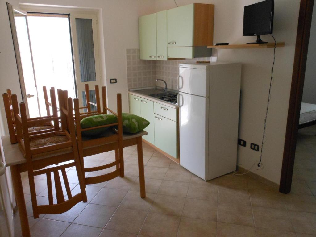 A kitchen or kitchenette at Residence e B&B La Cappella Del Convento