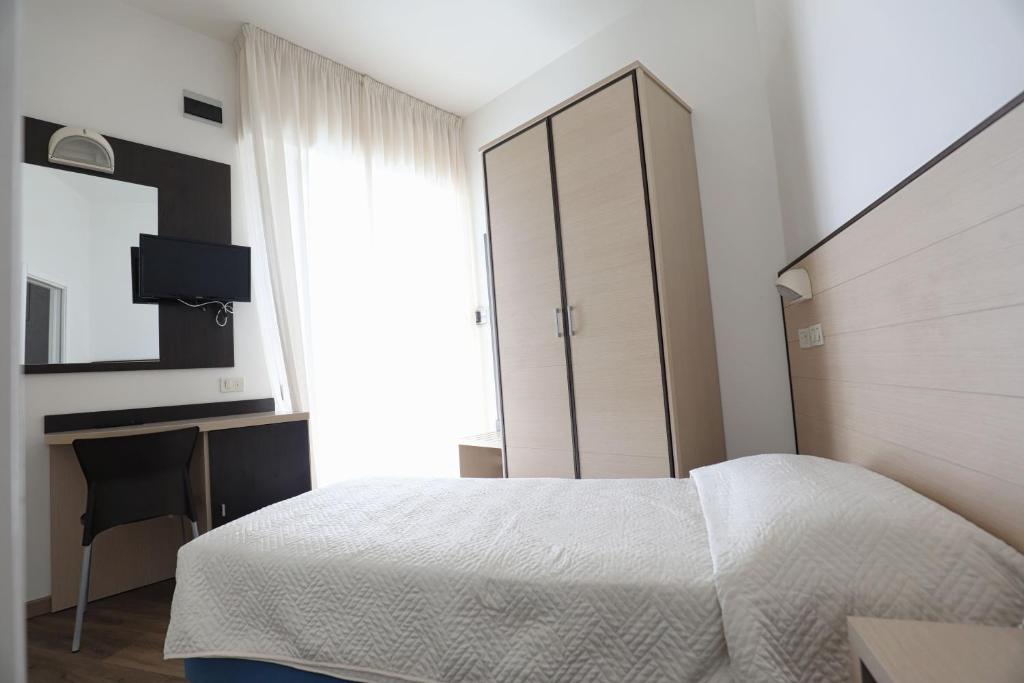 Postel nebo postele na pokoji v ubytování Hotel Daniel's FRONTE MARE