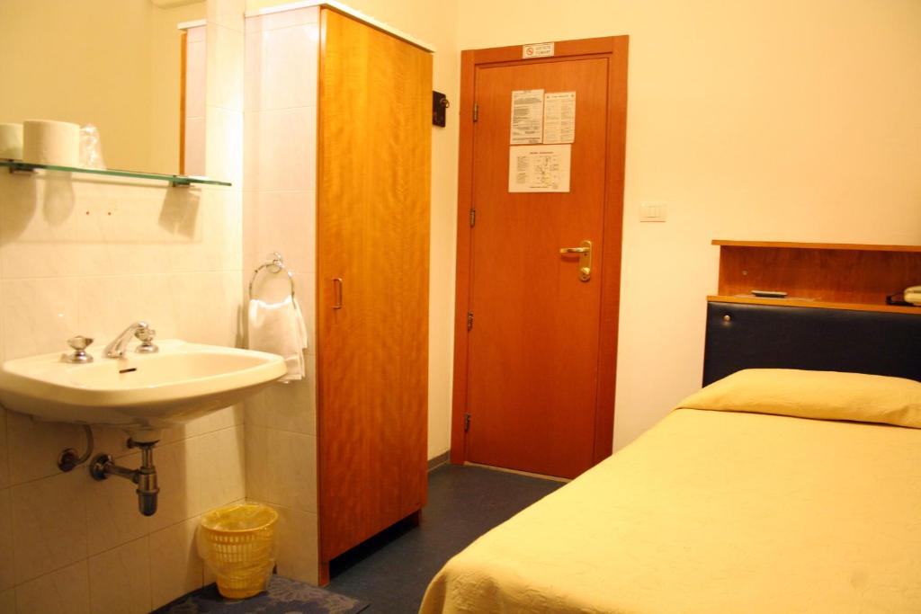 Postel nebo postele na pokoji v ubytování Hotel Romagna