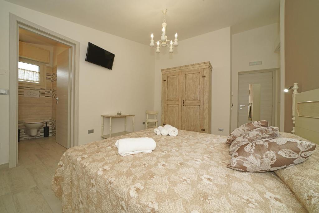 Postel nebo postele na pokoji v ubytování Quarantotto B&B