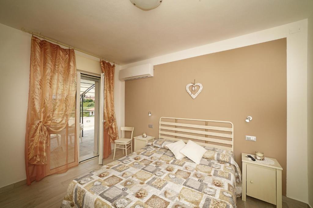 Postel nebo postele na pokoji v ubytování Quarantotto B&B