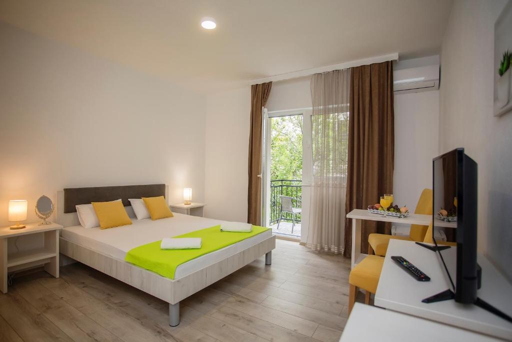 Postel nebo postele na pokoji v ubytování Villa Odobasic Rooms