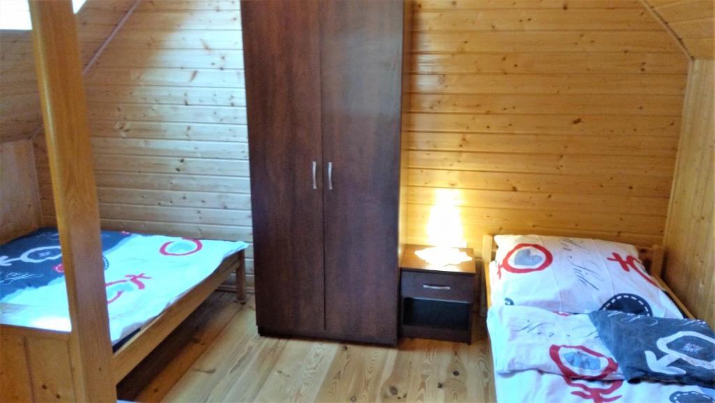 Postel nebo postele na pokoji v ubytování Słoneczny Zakątek