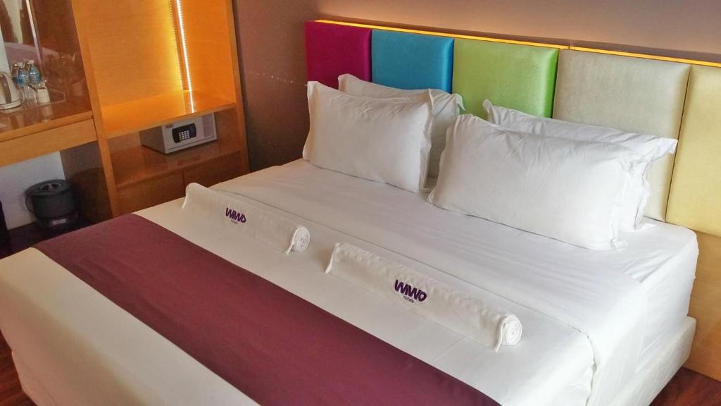 Postel nebo postele na pokoji v ubytování WIWO Hotel